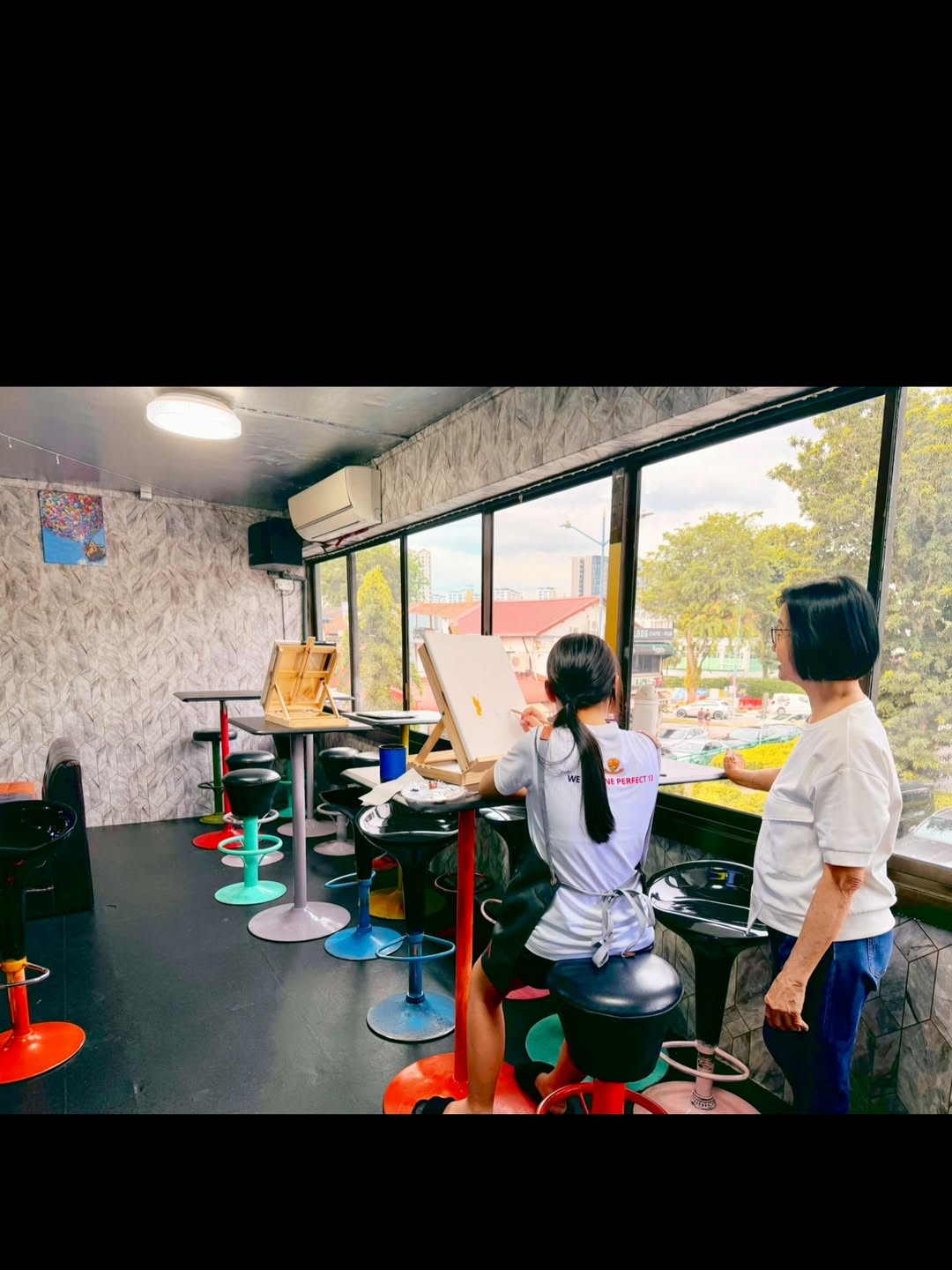 A young painter creating by the studio window