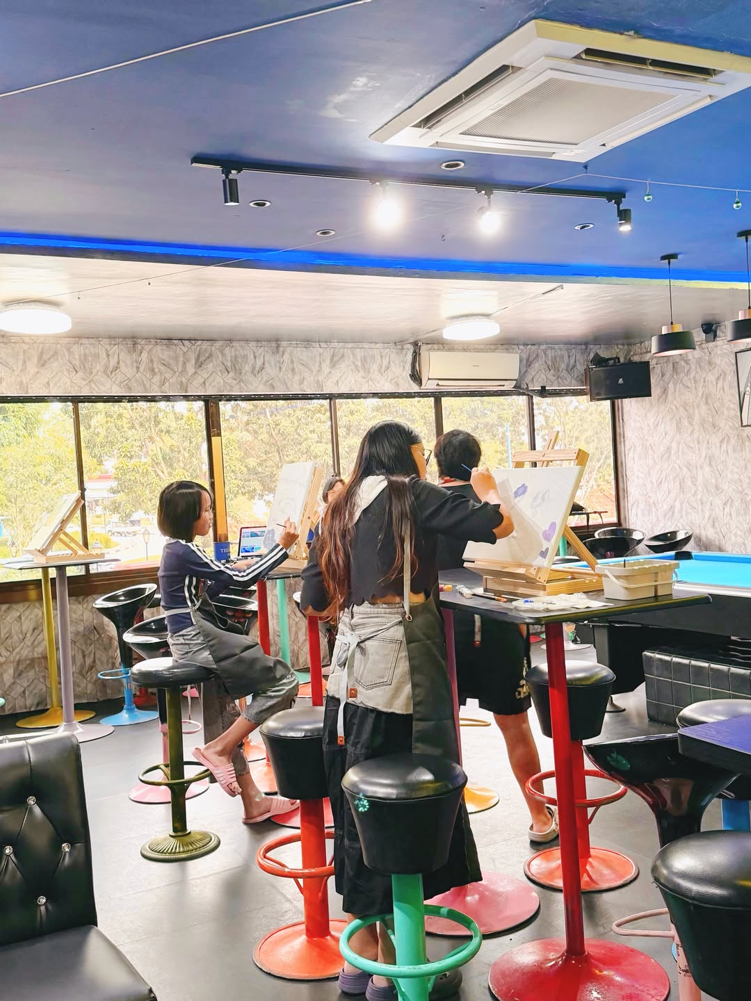 Customers painting together inside Chill Art Studio