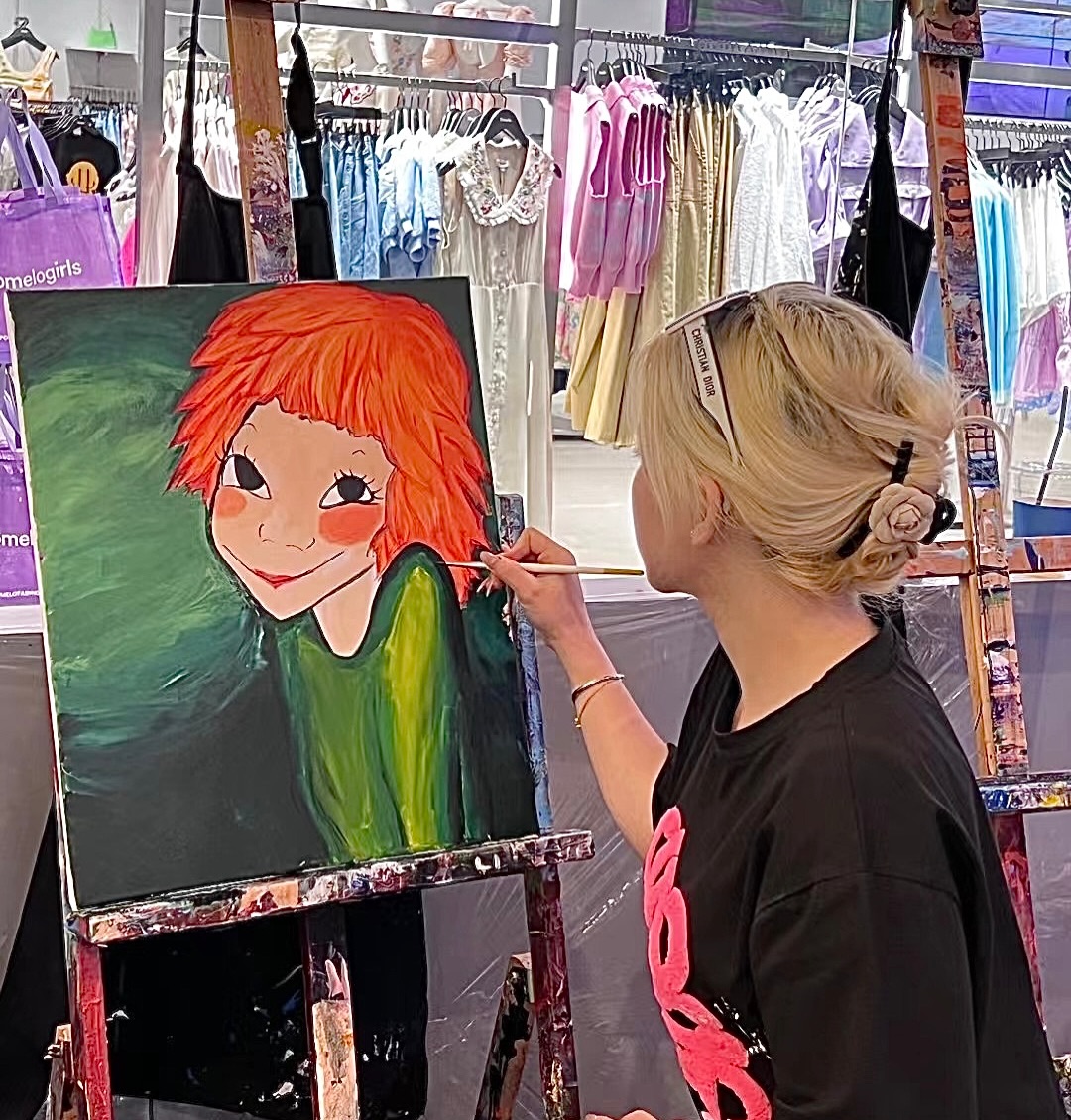 Artist painting at an easel